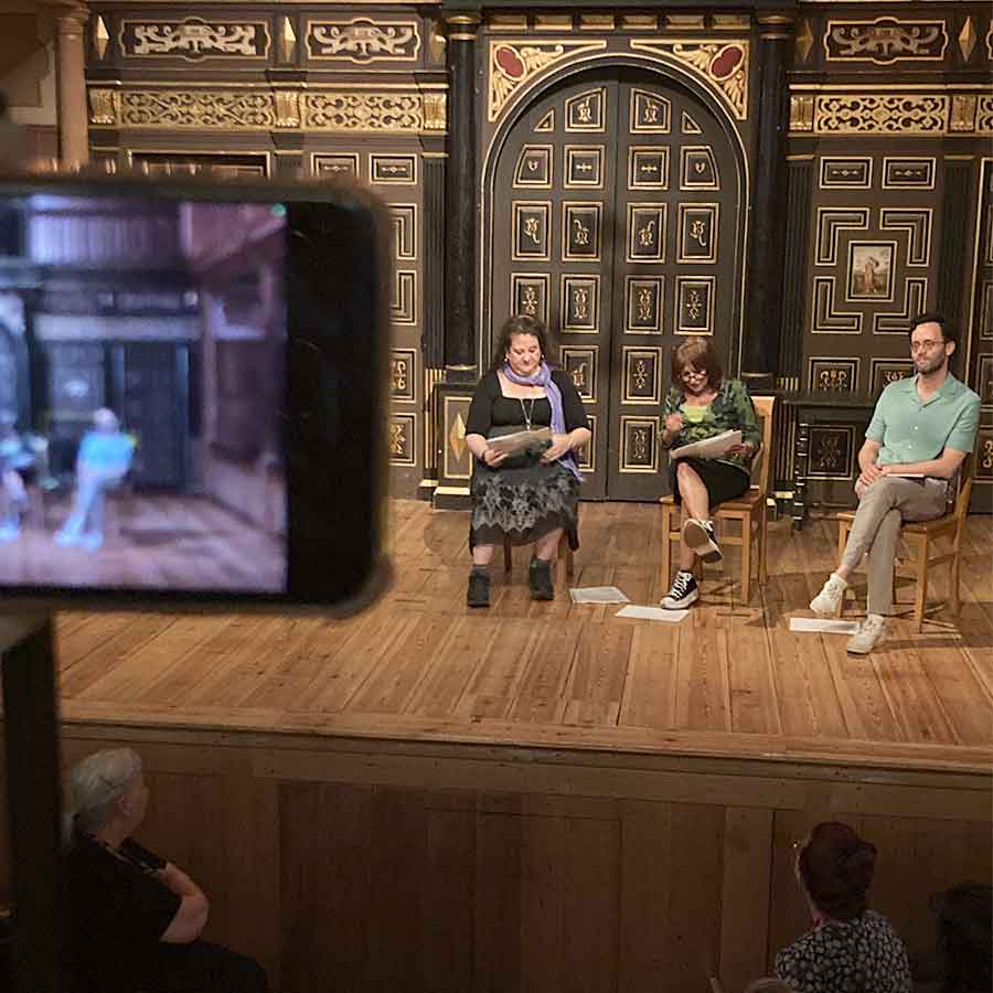 Migdalia Cruz, Ishia Bennison, and Dr. Will Tosh on stage in the Wanamaker Stage at Shakespeare's Globe.