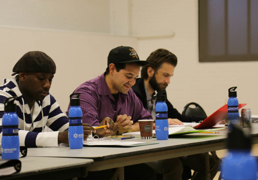 Actors participating in a table read during a Play On Shakespeare workshop.